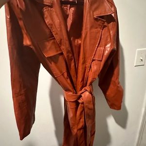 Brown leather coat . Never worn